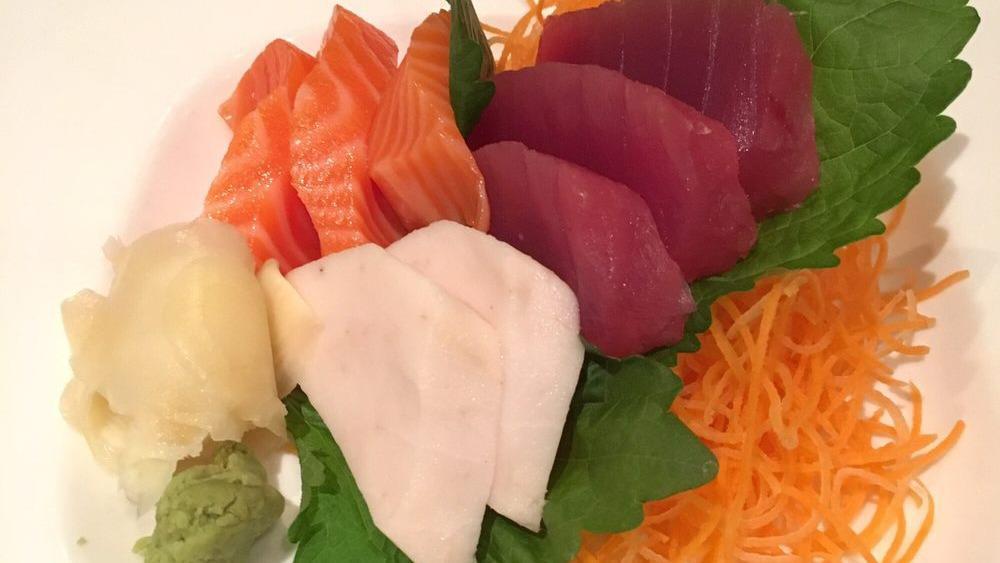 Sashimi Salad · Tuna, salmon, crab meat, shrimp, octopus mixed with sesame dressing sauce.