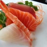 Sashimi · Seven pieces of assorted sliced of raw fish.
