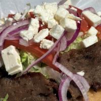 Gyro On Pita Bread · Lamb & Beef, lettuce, tomato, onion, feta, tzatziki sauce, pita bread.