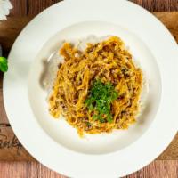 Pasta Bolognese · Served with a side salad and garlic bread.