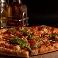 Chicken Florentine Pizza · Grilled chicken, spinach, red onions, cherry tomatoes, topped with parmesan, garlic and fres...
