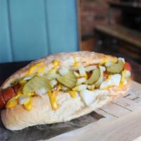 Texas Hot Dog · BBQ flavored dog served with pickle gherkins, tomato relish and onions topped with mustard.
