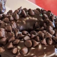 Triple Chocolate · A chocolate old-fashioned donut dipped in creamy chocolate icing and sprinkled with mini cho...