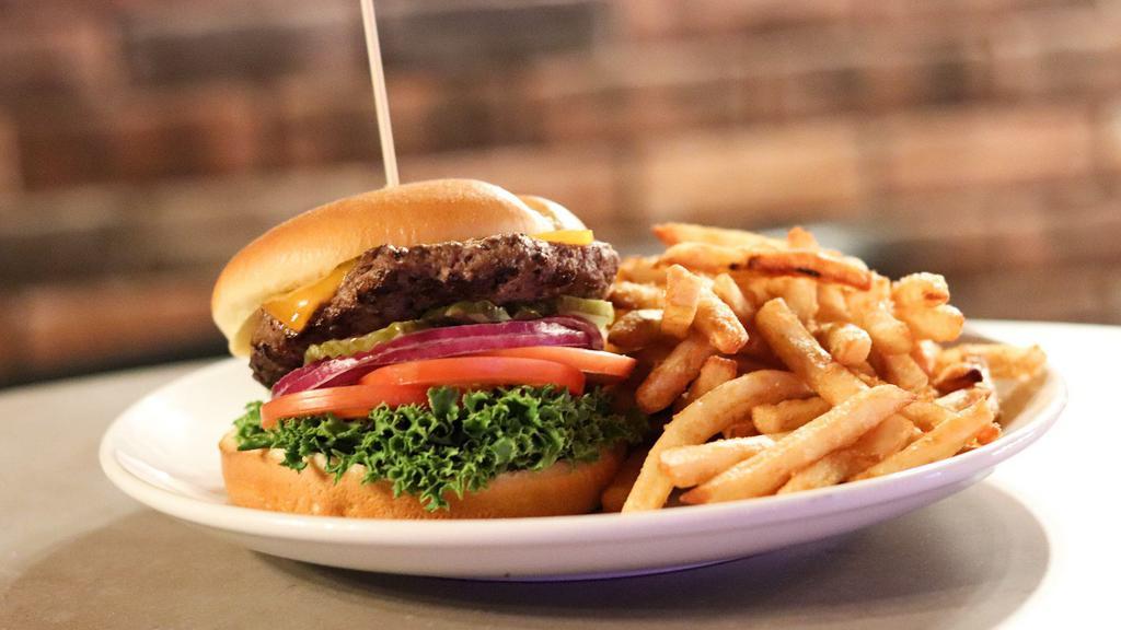 Cascade Burger · The classic with Cheddar cheese, lettuce, tomatoes, onions, pickles and our signature sauce. Served with fries. Add 3 slices of bacon for an additional charge