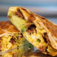 On The Boarder · Mexican chorizo, shredded cheddar, roasted peppers, caramelized onions, avocado, soft scramb...