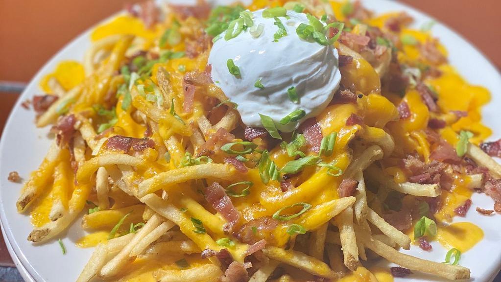 Loaded French Fries · our french fries topped with cheddar cheese, jack cheese, bacon, green onion and sour cream