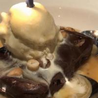 Brownie · Homemade fudge brownie with chopped nuts. With French Vanilla ice cream, carmel sauce, and c...