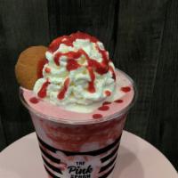 Strawberry Shake · Vanilla bean blended with real strawberries topped with whipped cream and a Nila Wafer