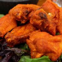 Wings · Choose 8 or 12 wings. Fresh never frozen deep fried to perfection and you choice of sauce an...