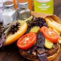 Veggie Burger · Black bean veggie patty topped with mushrooms, tomato, pickle, mixed greens, sauteed onions ...