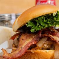 Rancher Burger · 1/2 lb seasoned beef patty, chipotle gouda, bacon, grilled onions, mixed greens, house spicy...