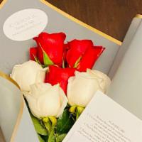 Red And White Roses Wrapped  With  A Bow · Three long stem red roses accompanied by Four white  long stem roses wrapped with a bow. Thi...