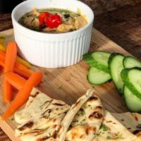 Hummus Plate · House made chimichurri hummus, warm pita bread, carrots, Persian cucumbers