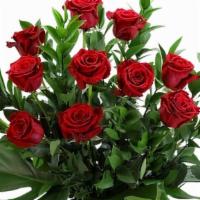 Ravishing Red Dozen Roses · A dozen premium long stemmed roses arranged with a combination of tropical greens. Filler is...