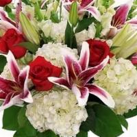 Stargazin' · A luxurious collection of star gazer lilies, roses, and a bed of hydrangea. A classic!