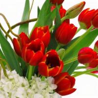 Totally Tulips · This arrangement is a classic arrangement sure to brighten anyone's V Day. A glass vase fill...