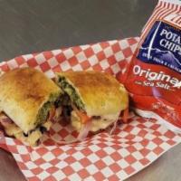 Gimme The Greek Sandwich · Pesto sauce with chicken, black olives, red onions, cheese, and tomatoes.