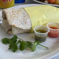 Sun Burrito · Two scrambled eggs, melted cheese,choice of meat (bacon/ham/turkey/chorizo) potatoes, wrappe...