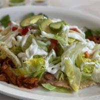 Huarache · Comes with beans, meat, lettuce, tomatoes, onions, sour-cream and avocado.