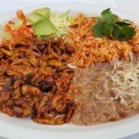 Plate Combination · Rice, beans, lettuce, sour cream, avacado, paried with corn tortillas with chicken or pork.