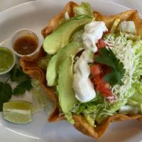 Taco Salad · Rice, beans, choice of meat, lettuce, avocado, tomatoes, sour-cream, cheese, inside a bowl-l...