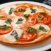 Margherita · tomato sauce, fresh mozzarella, fresh tomato, basil,
and oregano