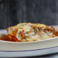 Lasagna Al Forno · layers of pasta with ground beef, ricotta, mozzarella, tomato sauce, béchamel sauce topped w...