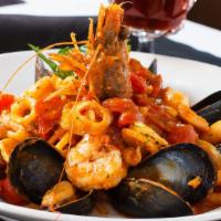 Zuppetta Di Mare · shrimp, mussels, squid, scallop, clams sautéed in a garlic marinara sauce accompanied with l...