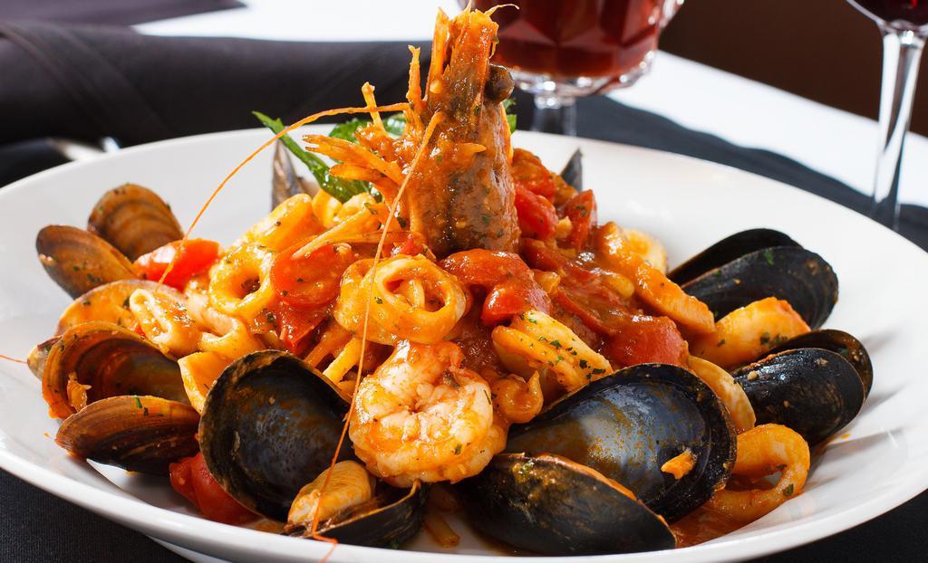 Zuppetta Di Mare · shrimp, mussels, squid, scallop, clams sautéed in a garlic marinara sauce accompanied with linguine pasta