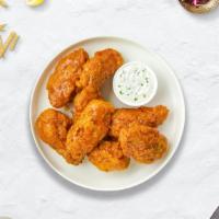 Habanero Here Wings · (6 pieces) Fresh chicken wings breaded, fried until golden brown, and tossed in mango habane...