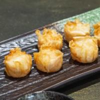 Shumai (6 Pieces) · Shrimp and vegetable steamed dumpling.
