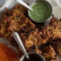 Vegetables Pakora · Onion, spinach, cabbage batter with chickpeas flour deep fried with Himalayan herbs and spic...