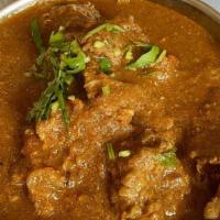 Lamb Curry · Boneless lamb cooked in onion and tomato sauce with himalayan herbs and spices.