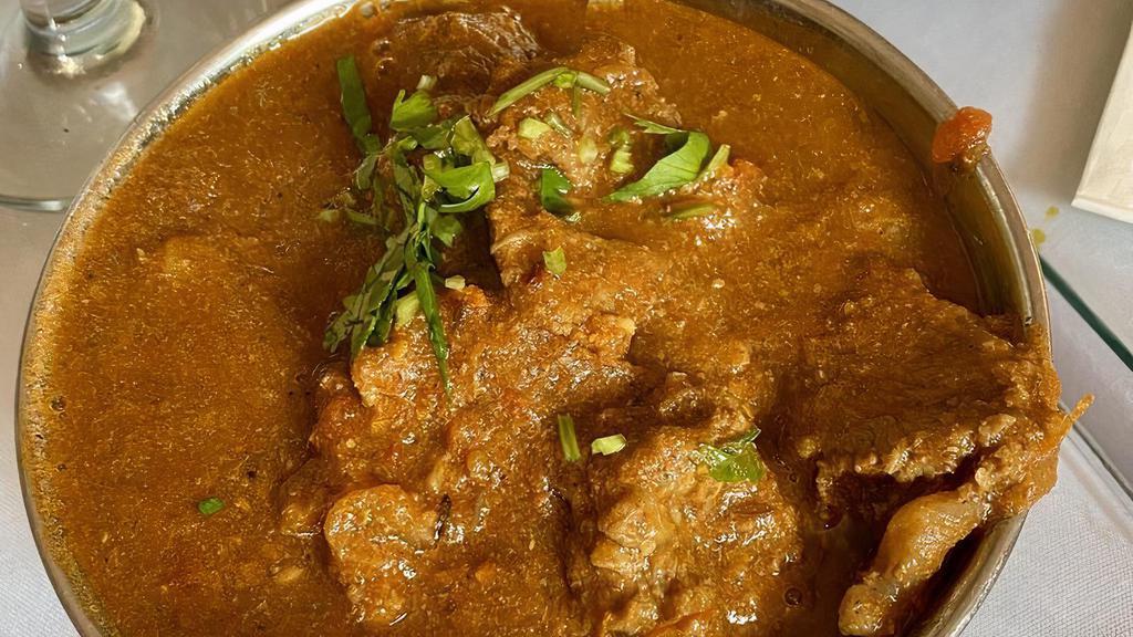Lamb Curry · Boneless lamb cooked in onion and tomato sauce with himalayan herbs and spices.