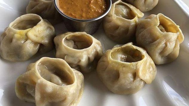 Vegetables Momo (8 Pc) · Steamed dumplings filled with minced cabbage, fresh spinach, cashew nuts, onion, cilantro, green onion and himalayan herbs and spices. Serve with special himalayan sauce.