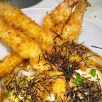 Shrimp Doburi · Deep fried breaded shrimp, egg and vegetables served over steamed rice.