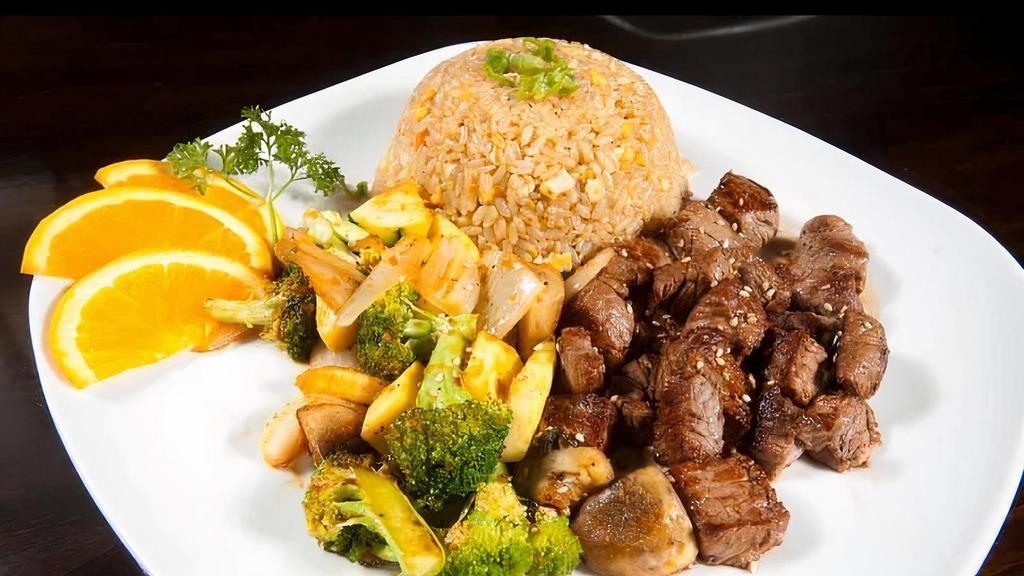 Ny Strip · Teppanyaki style grilled NY steak to desired temperature,  side of fresh vegetable, and fried rice.