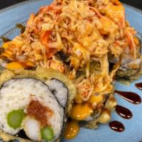 Gait Crasher · Shrimp tempura, spicy tuna, asparagus, topped with spicy crab, eel sauce.