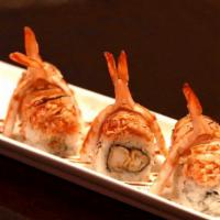 Derby Roll · Lobster tempura, topped with spicy crab, cooked shrimps and seared scallop. Eel sauce.