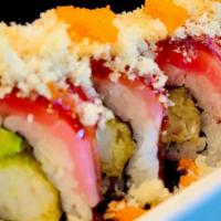 Playboy · Shrimp tempura, avocado, topped with tuna, crunch, masago, eel sauce.