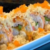 F-16 · Shrimp tempura, asparagus, cream cheese, topped with crabstick, crunch, masago, eel sauce, s...