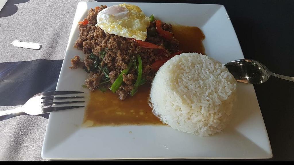 Gaprow · Choice of chopped chicken, pork, or beef stir-fried with bell peppers, Thai chilies, garlic, and sweet basil sauce. Top with two fried eggs.