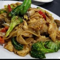 Phad Kee Mow (Drunken Noodles) · Flat rice noodles stir-fried with garlic, eggs, sweet basil, bell peppers, bok choy, broccol...