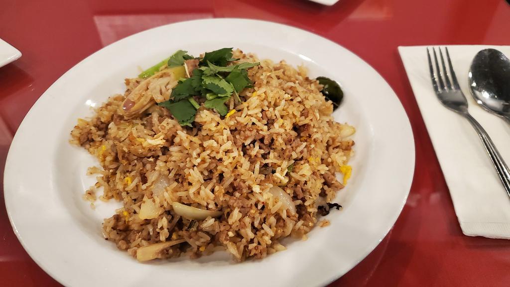 Tom Yum Fried Rice · House fried rice with egg in Tom yum flavour with the chopped lemon grass, lime leave, cilantro and galangal