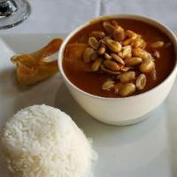 Massaman Curry · With massaman sauce, peanut sauce, and coconut milk, prepared with potatoes, and roasted pea...