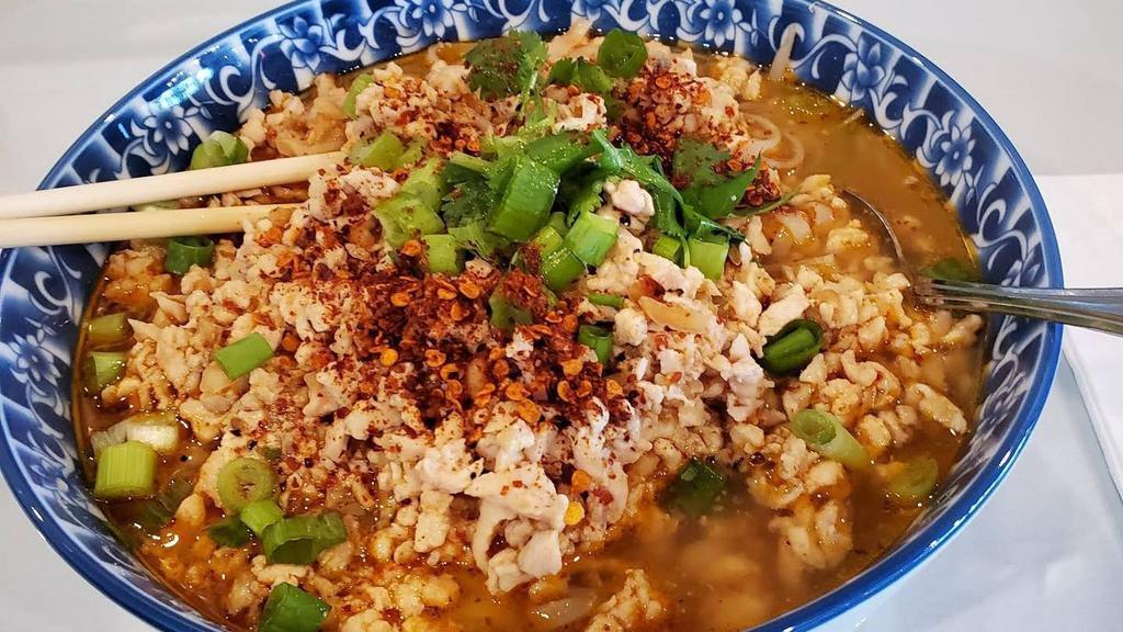 Noodle Tom Yum · Noodle in thick Tom yum broth with lime juice, roasted chili flakes, choices of ground meat, lime juice, and roasted peanuts.