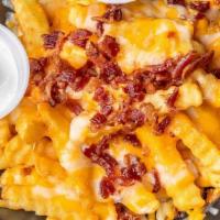 Loaded Fries · Topped with crumbled bacon, jack and cheddar cheese. Served with jalapeños and sour cream.
