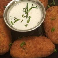 Stuffed Jalapenos · Stuffed Jalapenos served with house made Ranch dressing.