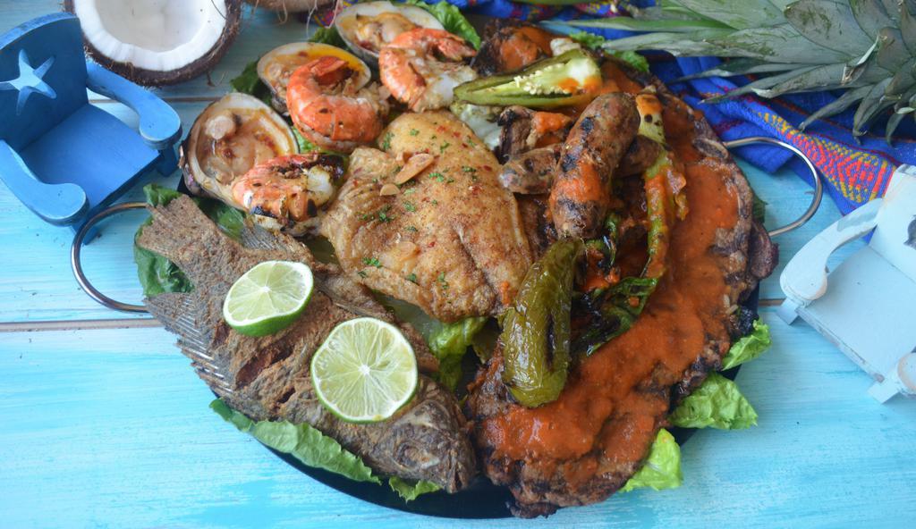Mar Y Tierra · Fried whole Fish, Filet Tilapia, Steak, Beef Ribs, 3 jumbo shrimp's, Pork sausage, serve with House salad, Rice and Fresh Made Tortilla
