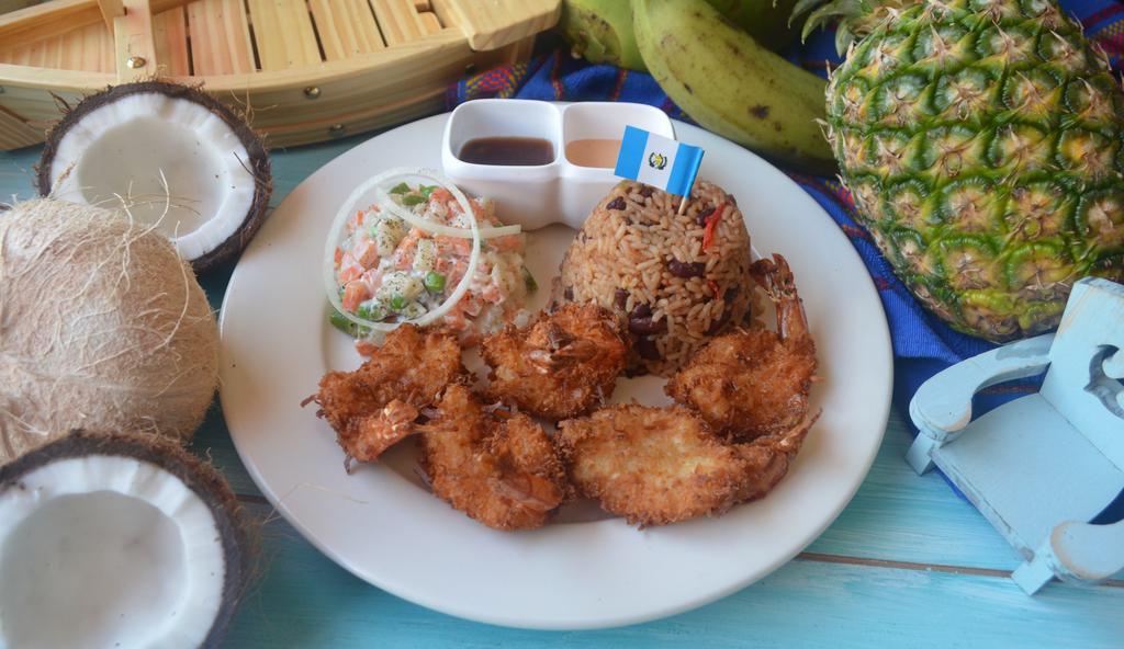Camarones Con  Coco · Home made coconut shrimps Jumbo serve with rice, beans, Russian salad & chipotle Sause